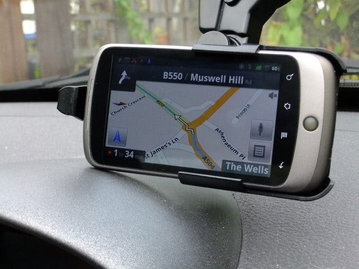 An image of a satnav mounted in a car 