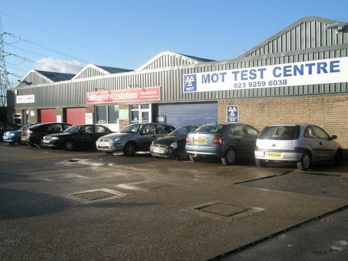 photograph of cars parked outside a British MOT test centre