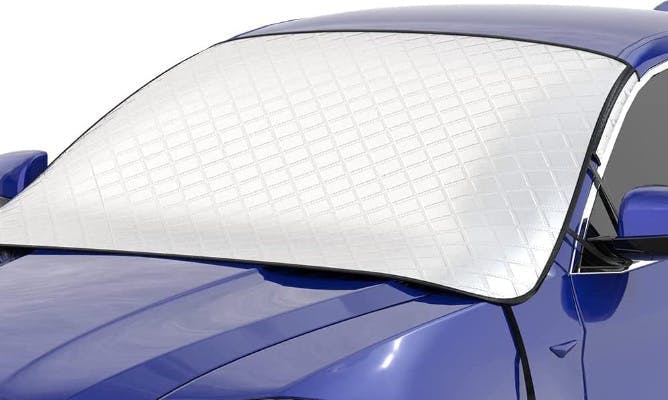 A car windsheild covered with a window cover