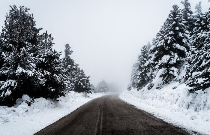 Empty winter road covered in snow