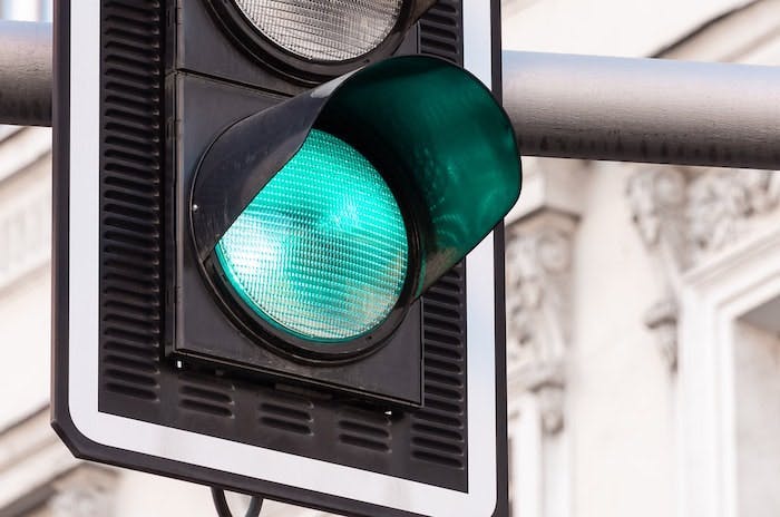 A image of a traffic light showing a green light 