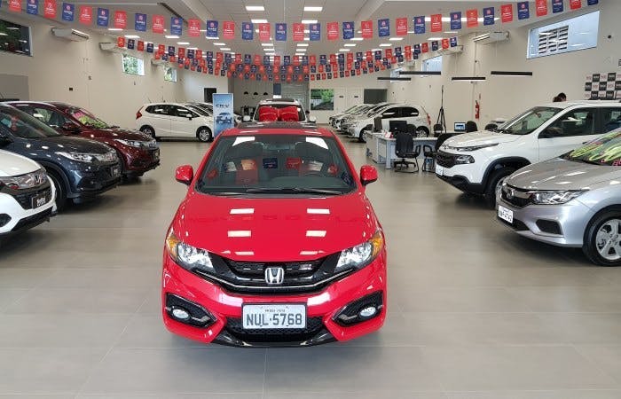 New red Honda in car dealership