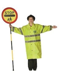 Lollipop person performing a sign to tell drivers that they must stop