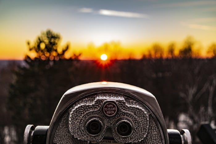 set of binoculars overlooking a viewpoint