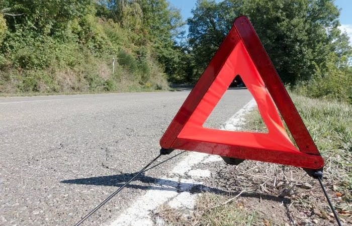 Warning triangle on quiet country road