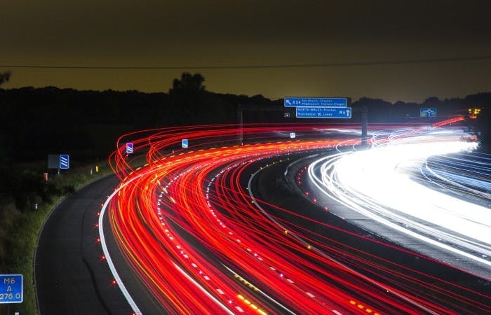 A timelapse image of a motorway at night