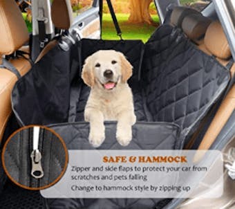 A young golden retriever dog in a car hammock