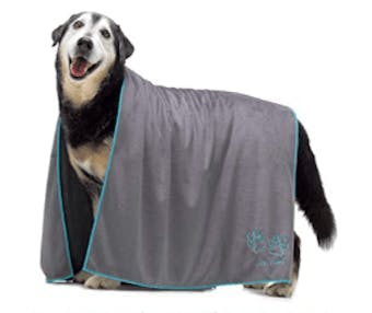 A dog draped in a microfiber towel