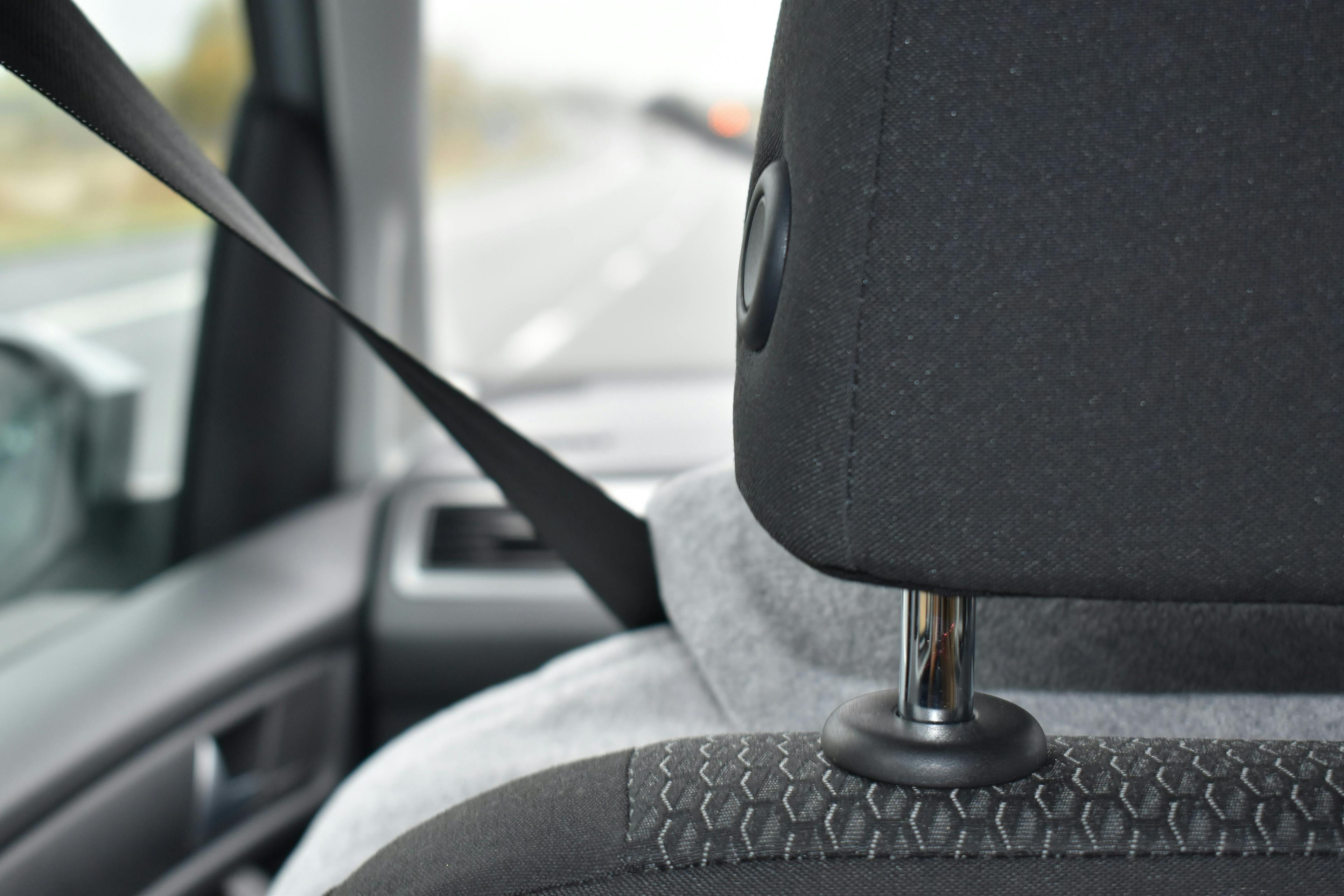 black car headrest and seatbelt