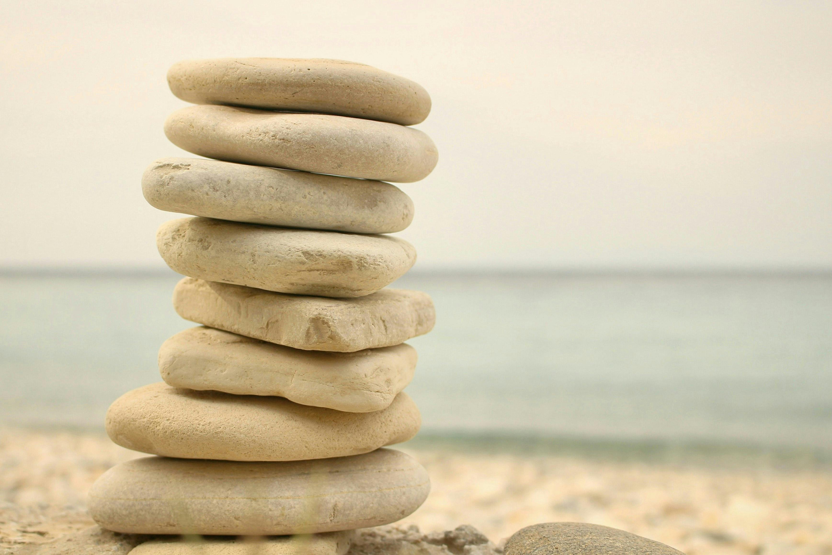 stack of zen stones on seashore