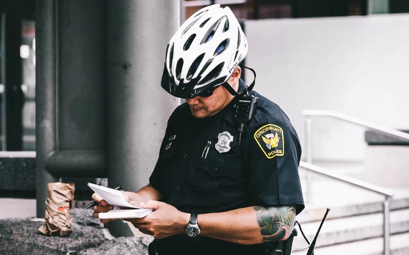 Police officer reading notes