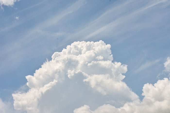 Large white cloud against light blue sky