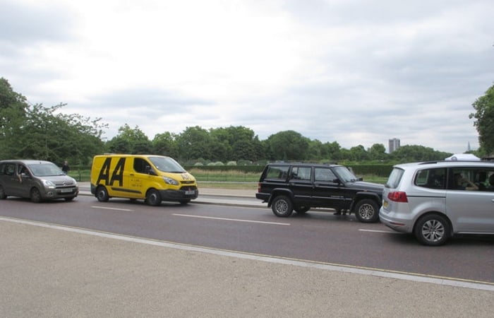 Yellow AA van behind black Range Rover