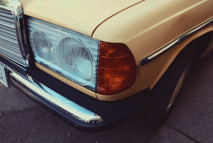 Close up of indicator light on yellow car