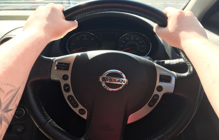 hands-on-steering-wheel-at-10-and-2