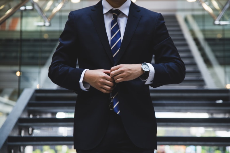 Person wearing business suit in office