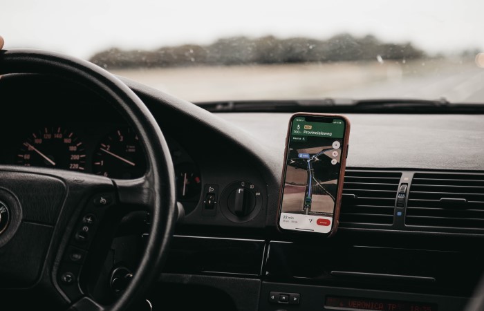 phone-being-used-as-a-sat-nav-next-to-steering-wheel