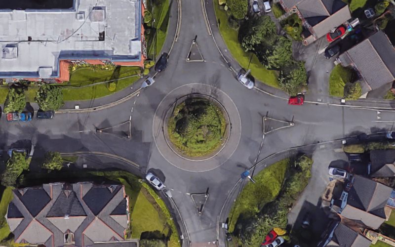 A bird's-eye view of a single-lane roundabout in Sharston.