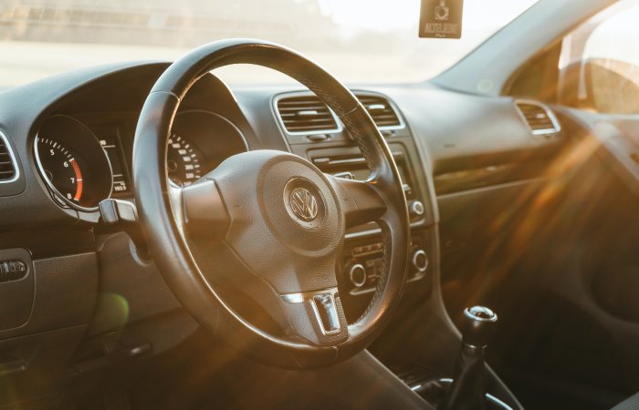 sun-shining-through-car-window-on-steering-wheel