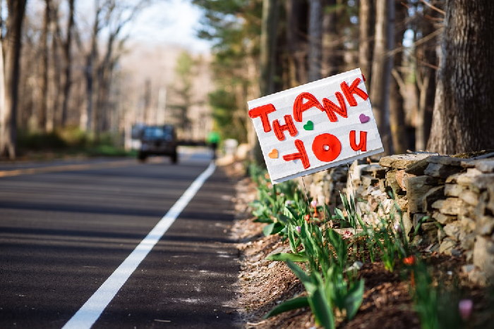 Handmade thank you sign at the side of a road